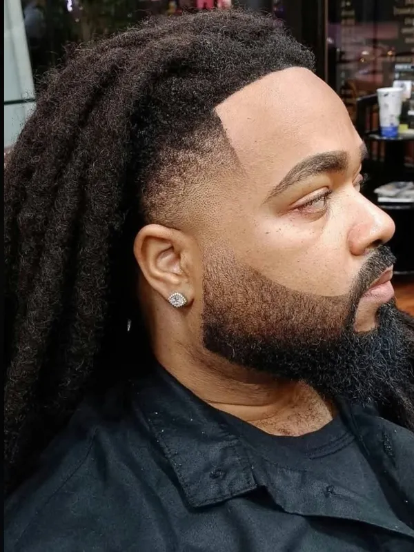 Long locs with a taper and full beard