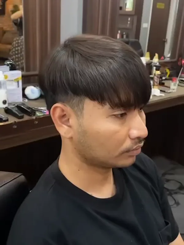 Sleek fringe after a down perm