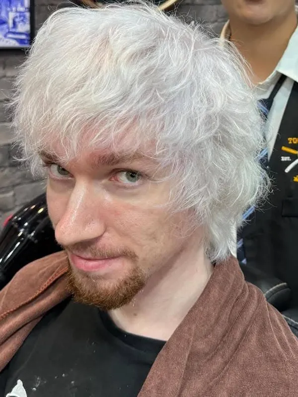 Platinum white textured hair with a goatee