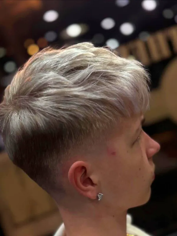 Ash blonde textured crop with a fade