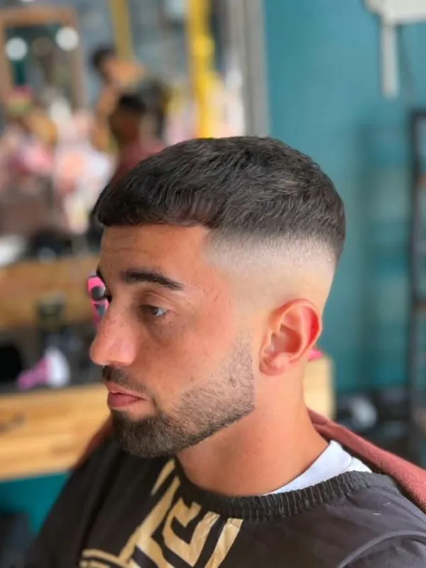Textured fringe with a skin fade and beard