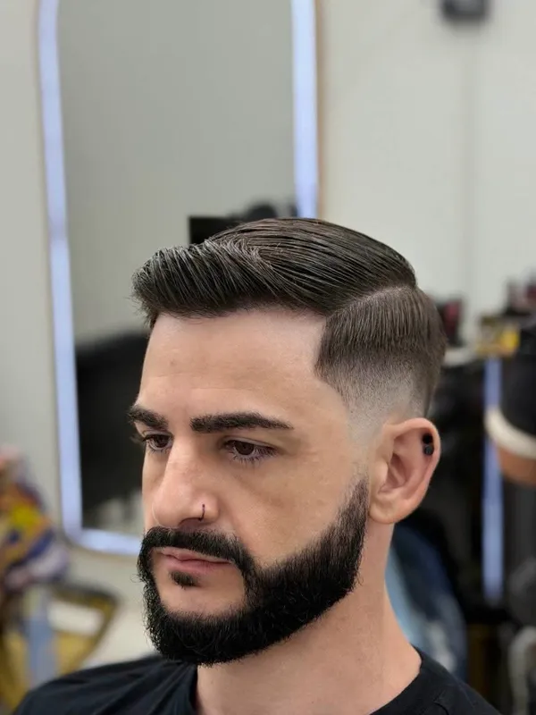 Side part with a beard and taper