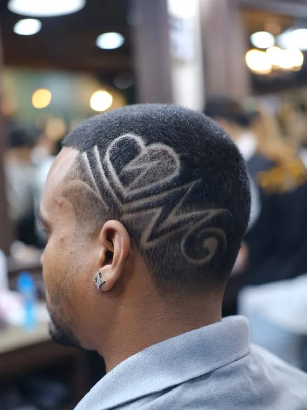Heart and line hair design on a skin fade