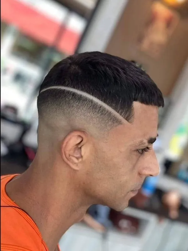 Curved hairline design with a skin fade