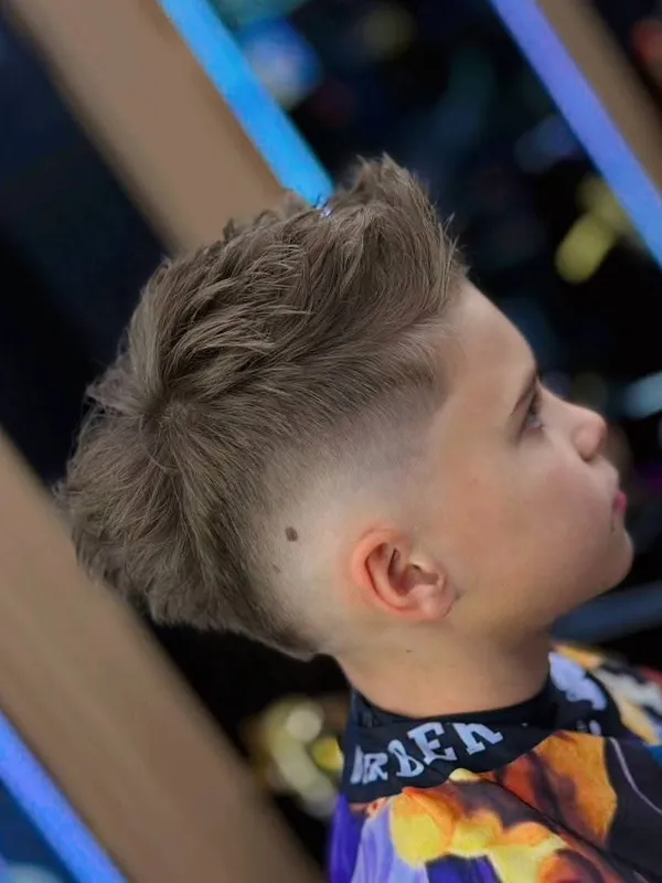 Boy with a textured top and skin fade