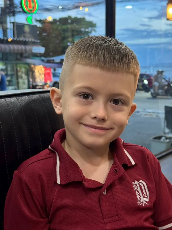 Smiling boy with a short crop