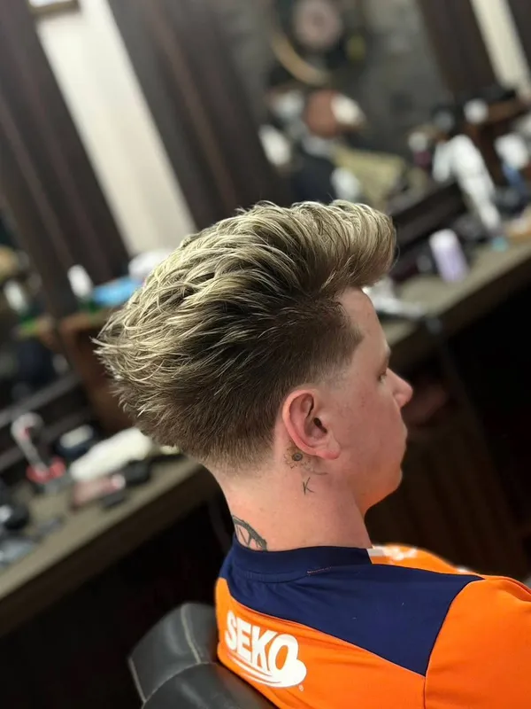 Blonde textured top with a taper fade