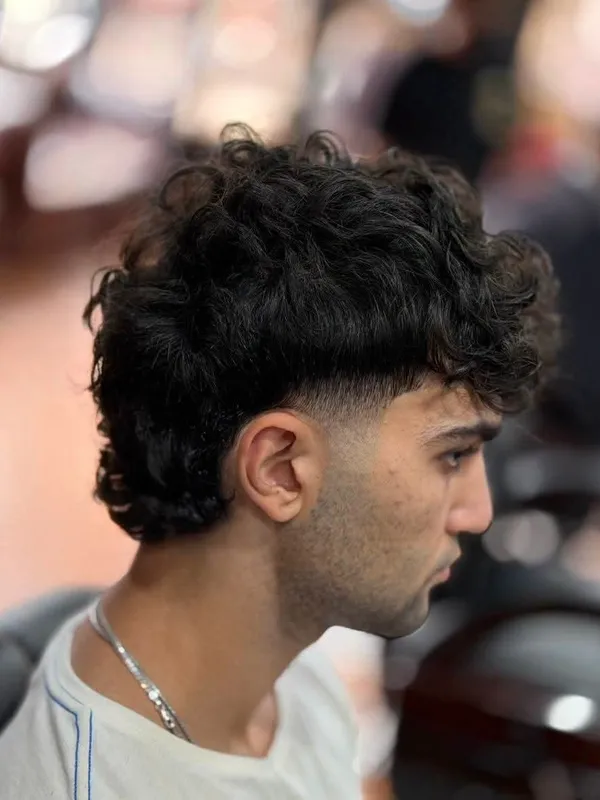 Curly mullet with a taper fade