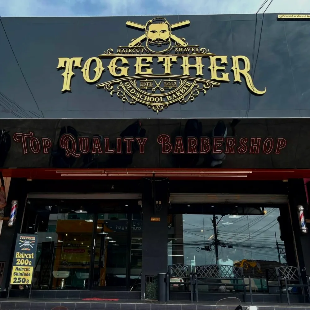 Khao Talo branch with a gold Together sign over a wide black shopfront