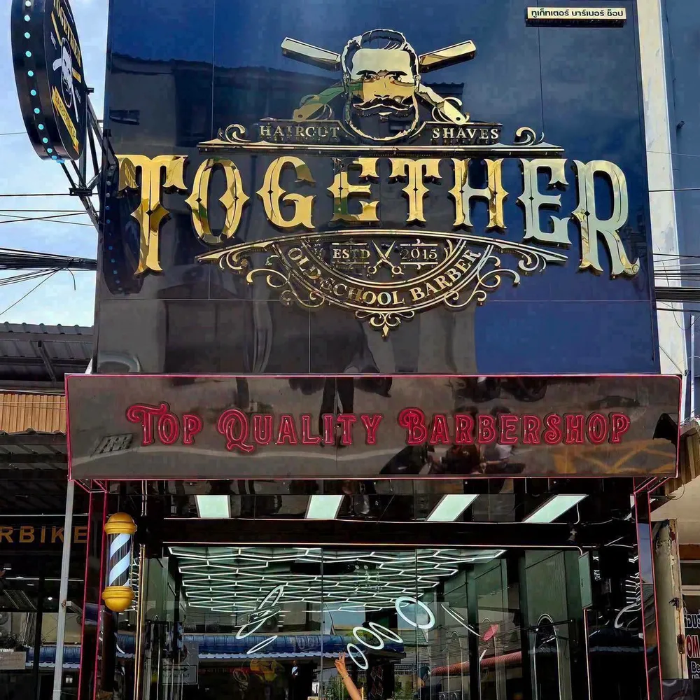 Pratumnak branch with a gold Together sign and glass front
