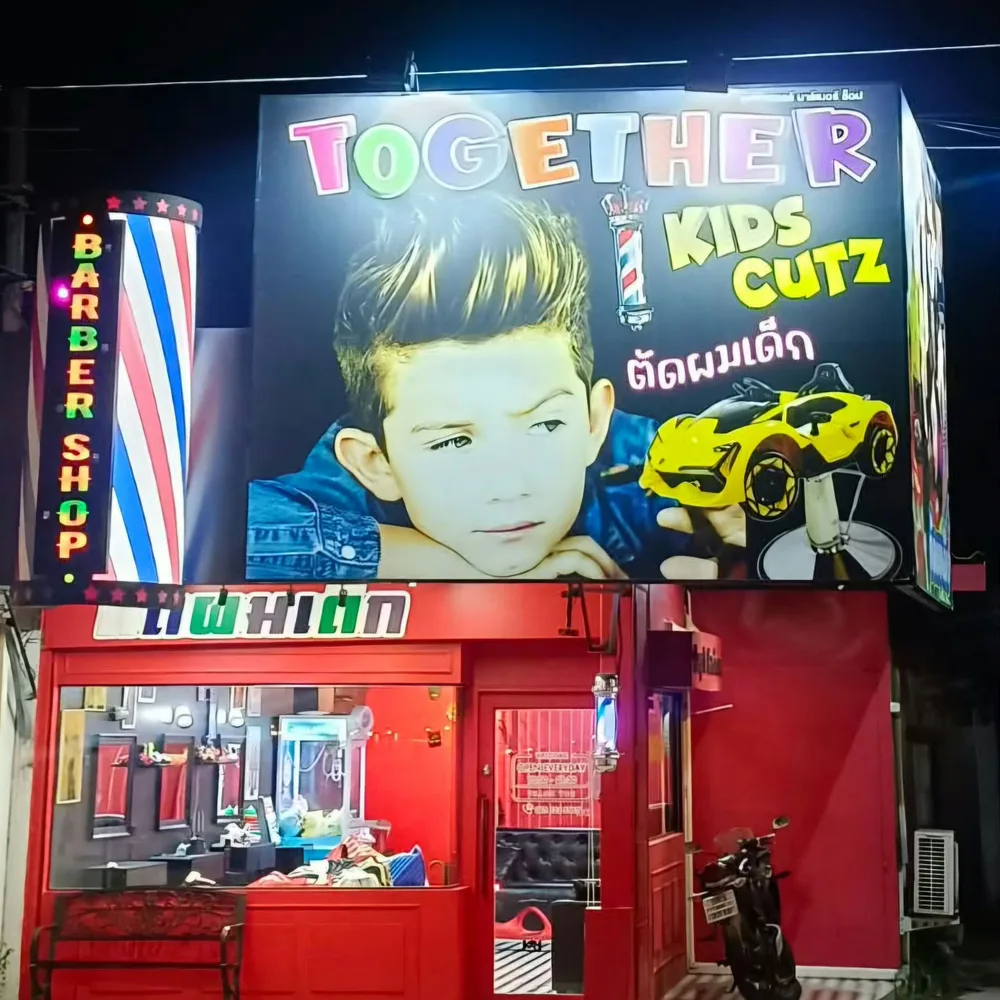 Together Kids Cutz with its colourful sign and red shopfront
