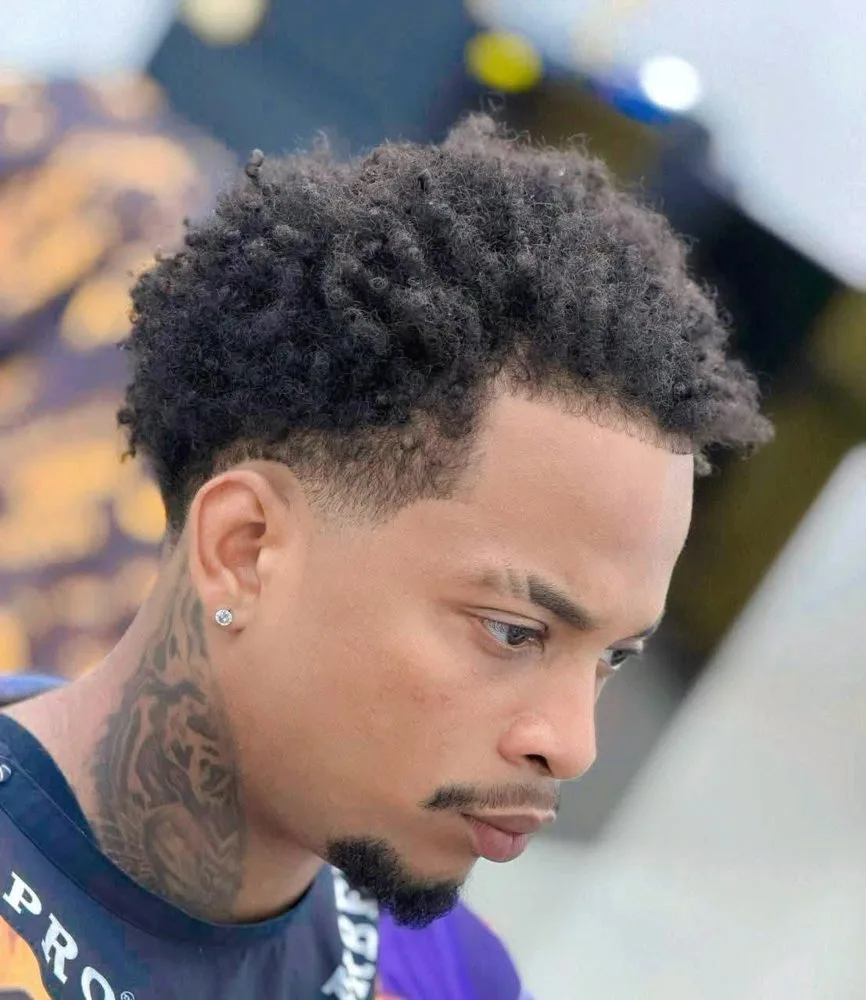 Curly high top with skin fade