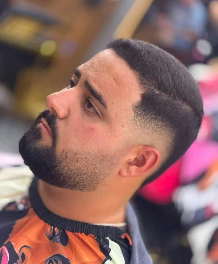 Pompadour with skin fade and beard